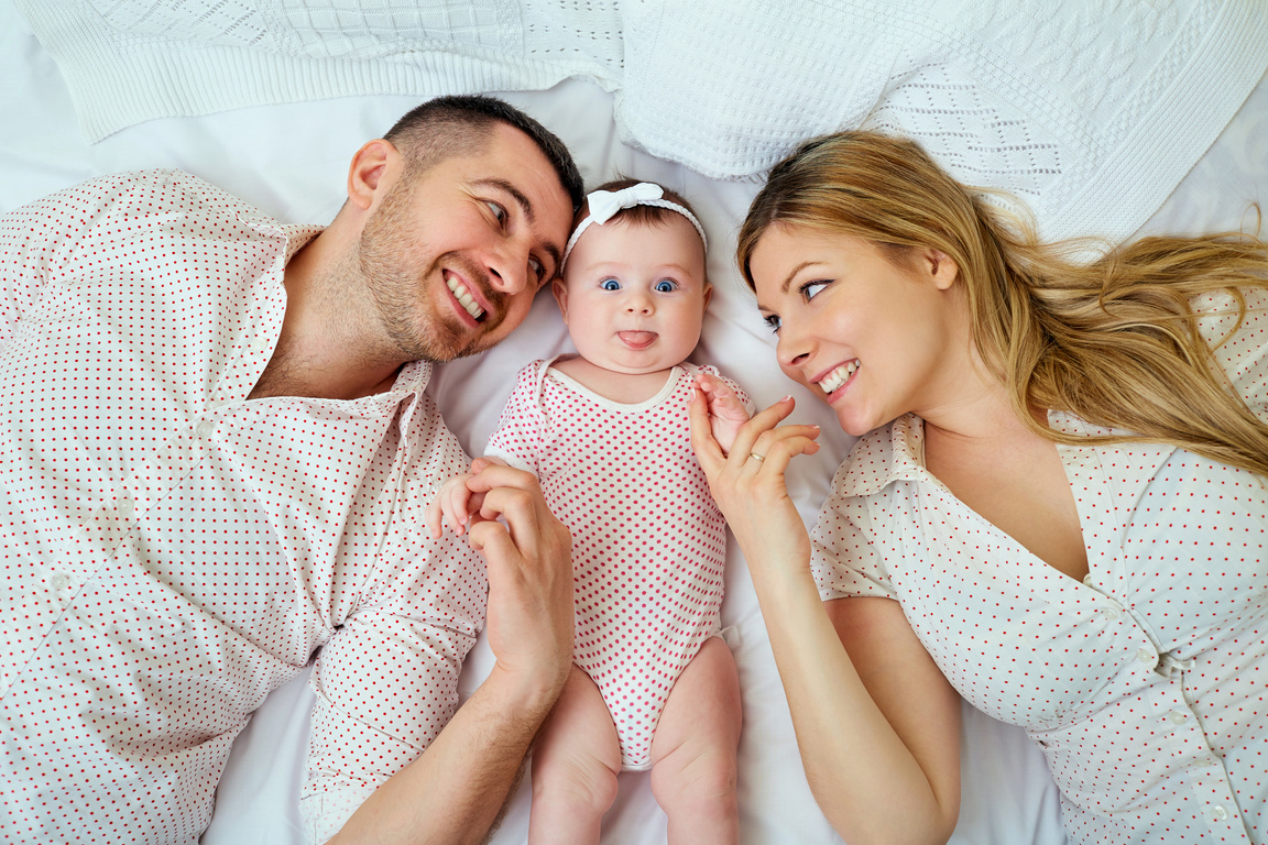 Parents and Baby in Bed