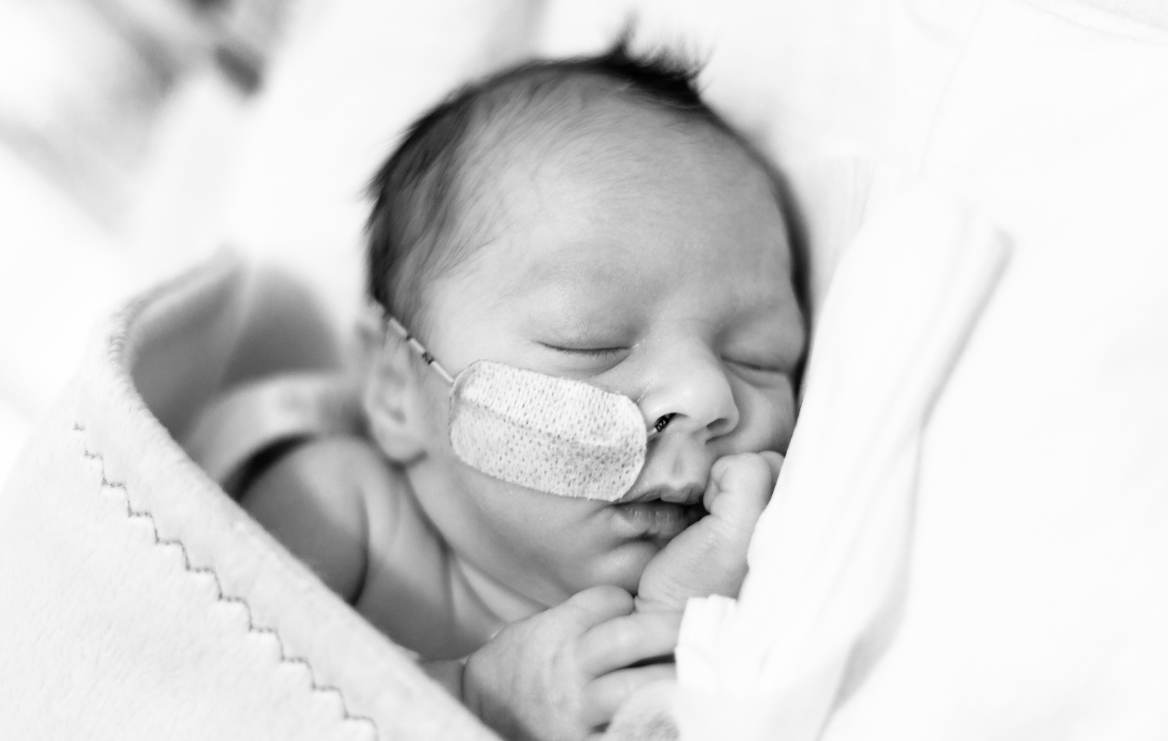 Premature baby in the neonatal intensive care unit sleeping
